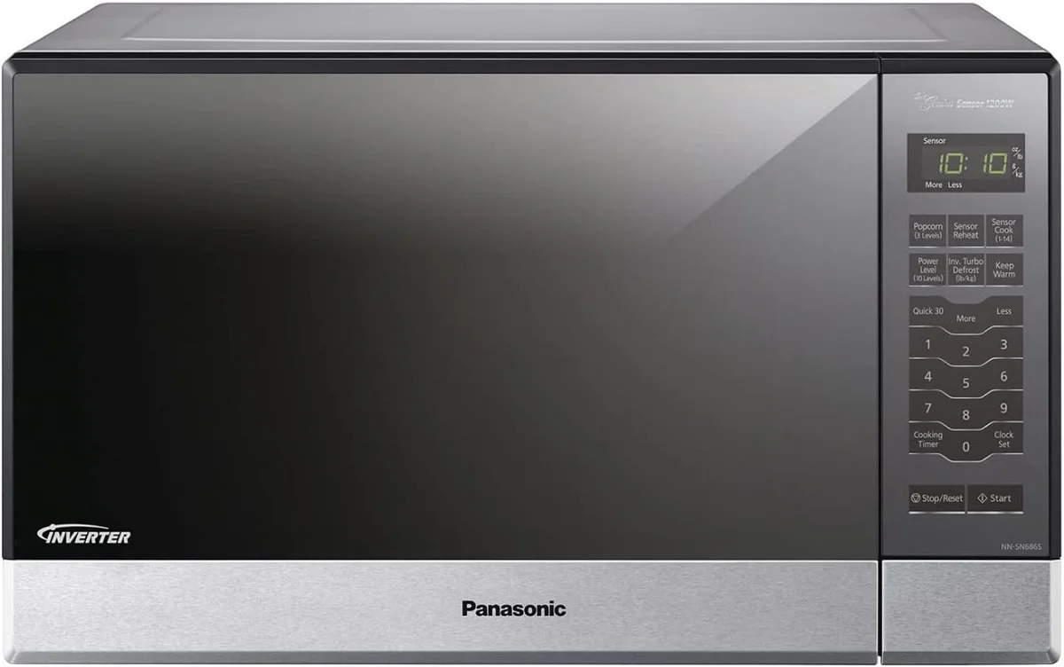 Panasonic NN-SN686S microwave 3/4 angle view showing stainless steel body, control panel, and left side