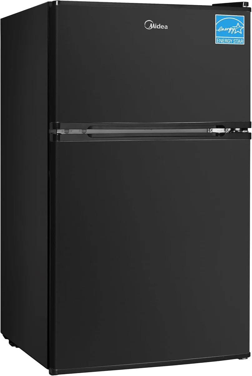 Midea WHD-113FB1 black double-door mini fridge with separate top freezer, closed, three-quarter angle view