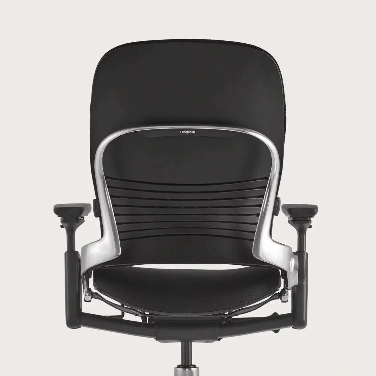 Steelcase Leap rear view showing flexible backrest, lumbar mechanism, and Steelcase branding