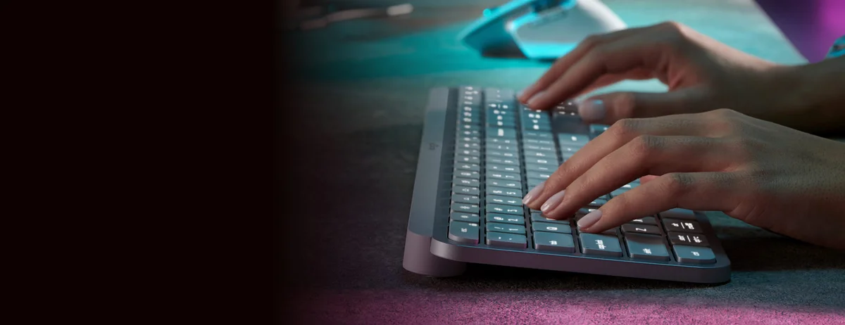 Logitech MX Keys S side angle showing low-profile key travel and smart backlighting illuminated
