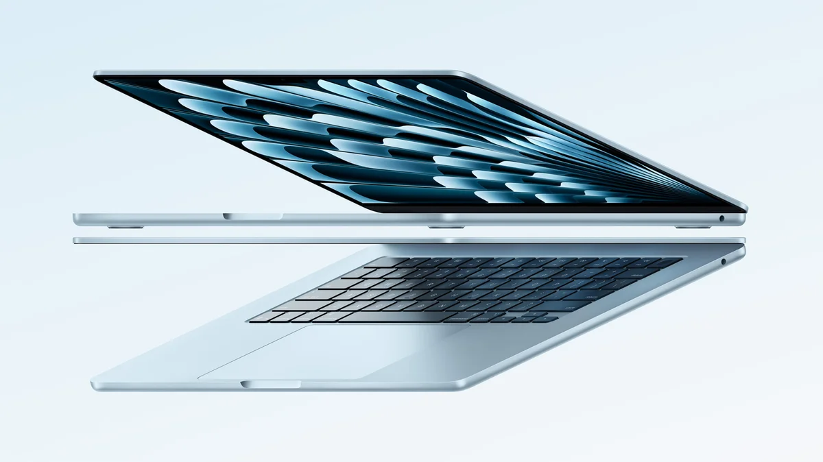 Apple MacBook Air M4 in Sky Blue, partially open showing keyboard and Liquid Retina display
