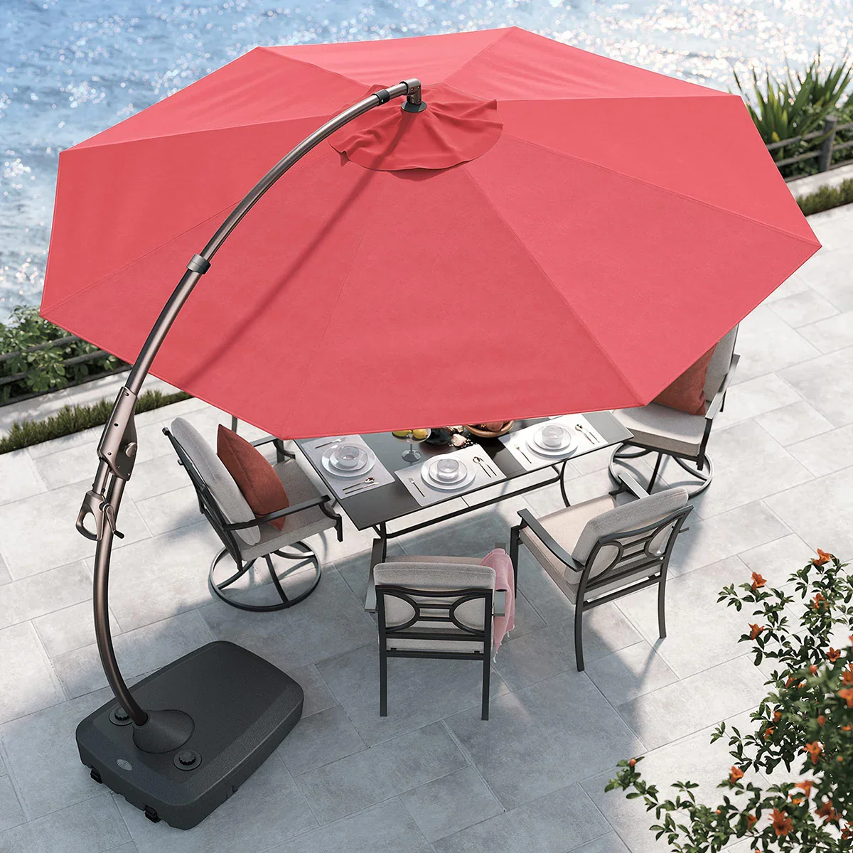 Grand Patio Napoli cantilever umbrella shading an outdoor dining set from above, waterfront patio setting