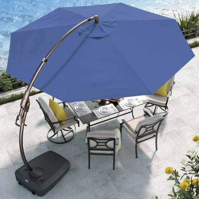 Grand Patio Napoli blue cantilever umbrella extending over an outdoor dining table, overhead lifestyle view