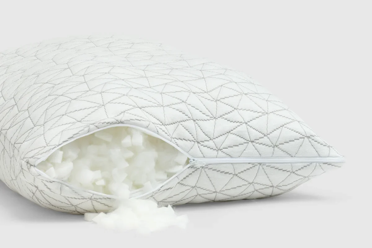 Coop Original Adjustable Pillow unzipped to show the shredded memory foam blend fill spilling out