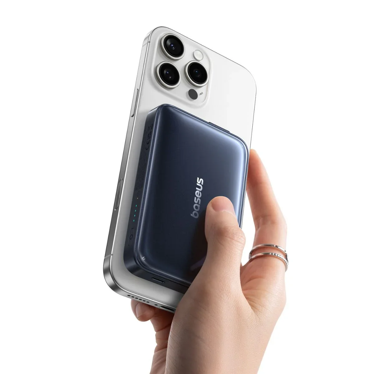 Baseus PicoGo AM61 magnetically attached to iPhone held in hand