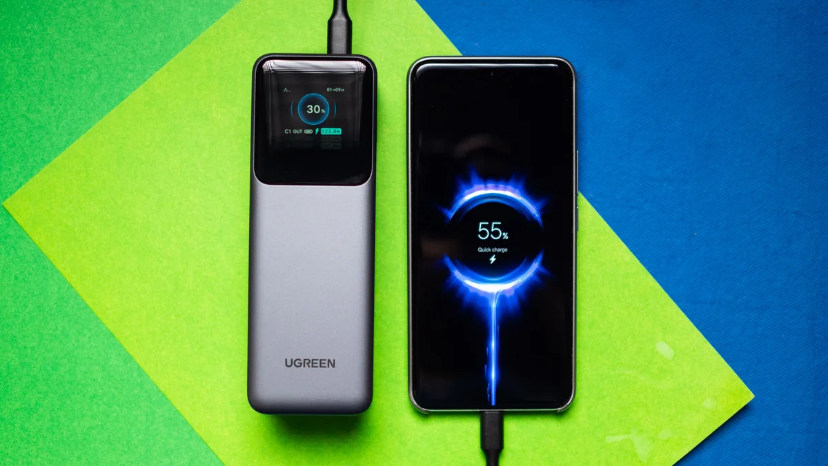 UGREEN Nexode 200W charging a smartphone with TFT display showing per-port power output