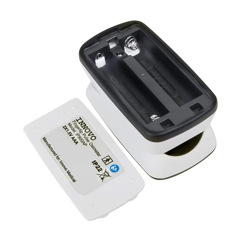 Innovo Deluxe iP900AP with battery compartment open showing the removable door and AAA battery bay