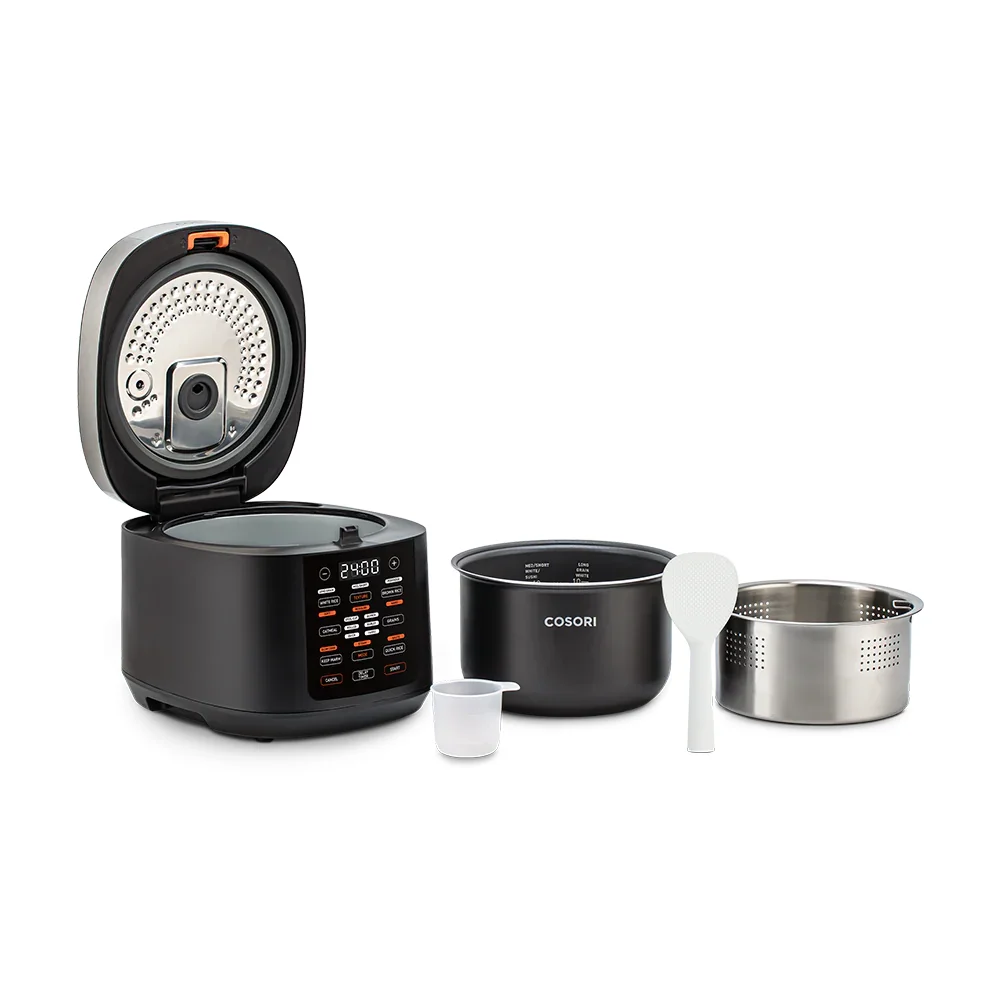 Cosori 5.0 Quart Rice Cooker with lid open beside its included accessories: ceramic nonstick inner pot, stainless steel steam basket, rice paddle, and measuring cup