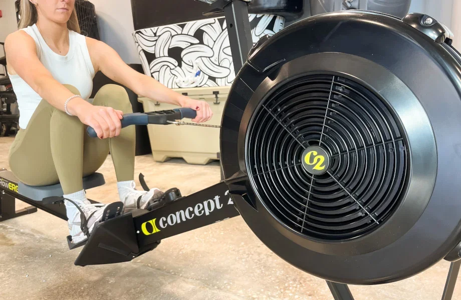 Concept2 RowErg — air resistance flywheel close-up with user in catch position