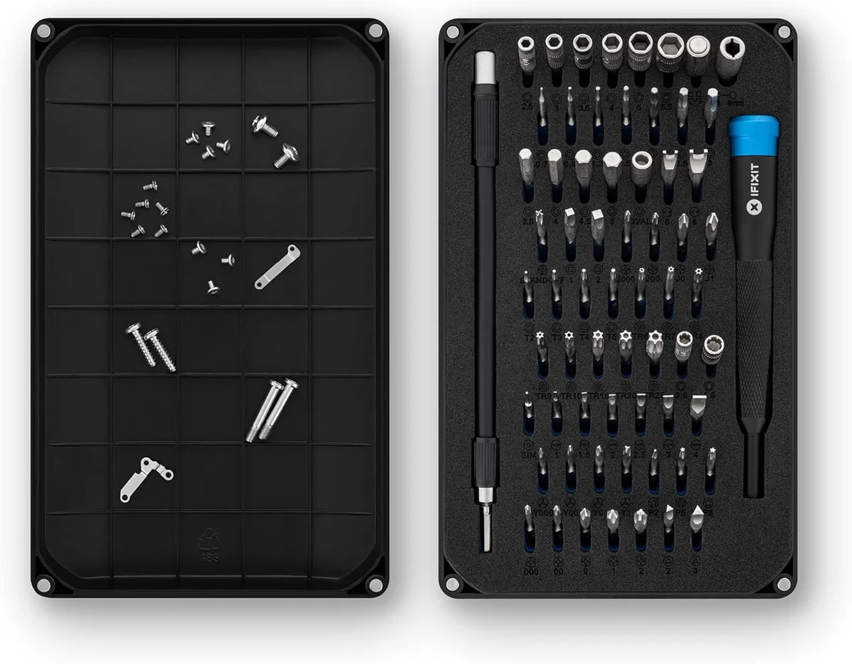 iFixit Mako Driver Kit top-down view showing all 64 precision bits and driver in foam tray