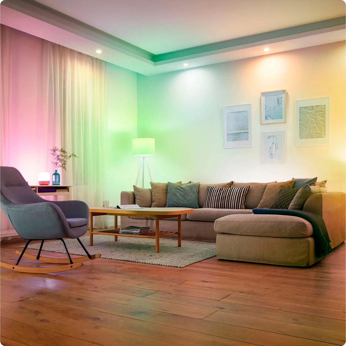 Living room lit in blended pink, green, and warm white by WiZ Color smart bulbs