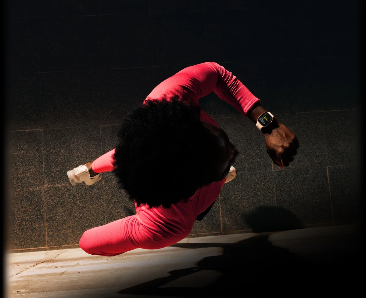 Apple Watch Series 11 worn on the wrist by an athlete mid-motion during an intense workout, illustrating fitness tracking in action