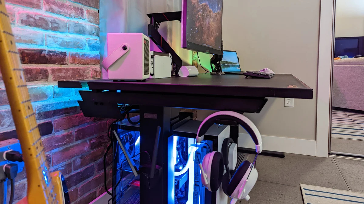 SecretLab Magnus Pro side view showing cable management tray, PC mount, and headphone hanger