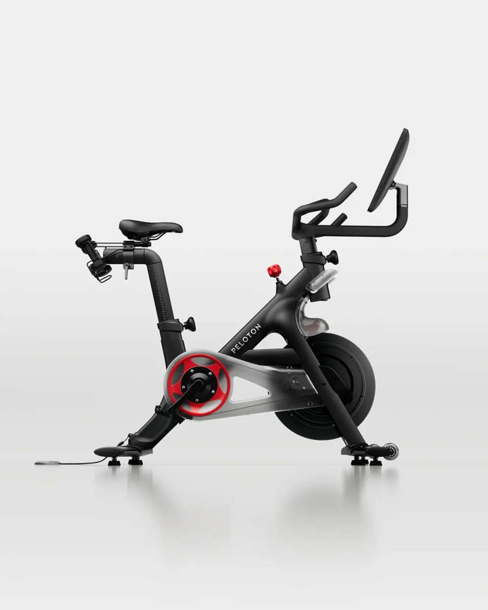 Peloton Bike right side profile showing frame and red resistance knob