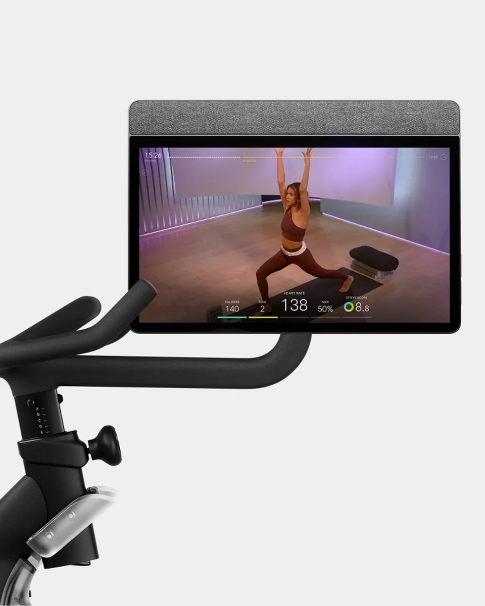 Peloton Bike 21.5-inch touchscreen close-up displaying live class with instructor and performance metrics