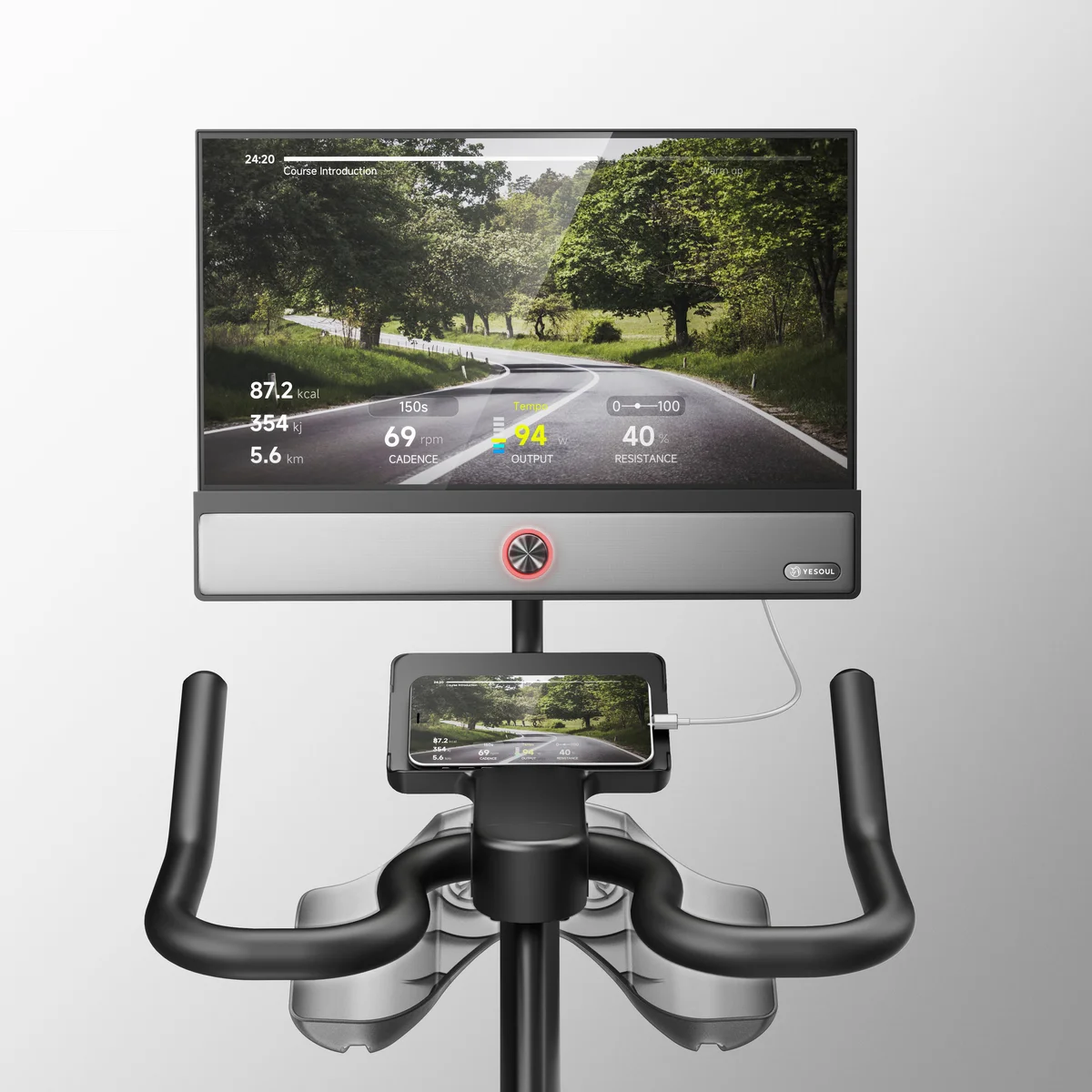 Yesoul G1M Plus close-up of the 21.5-inch HD screen displaying ride metrics with phone mirroring and handlebar controls