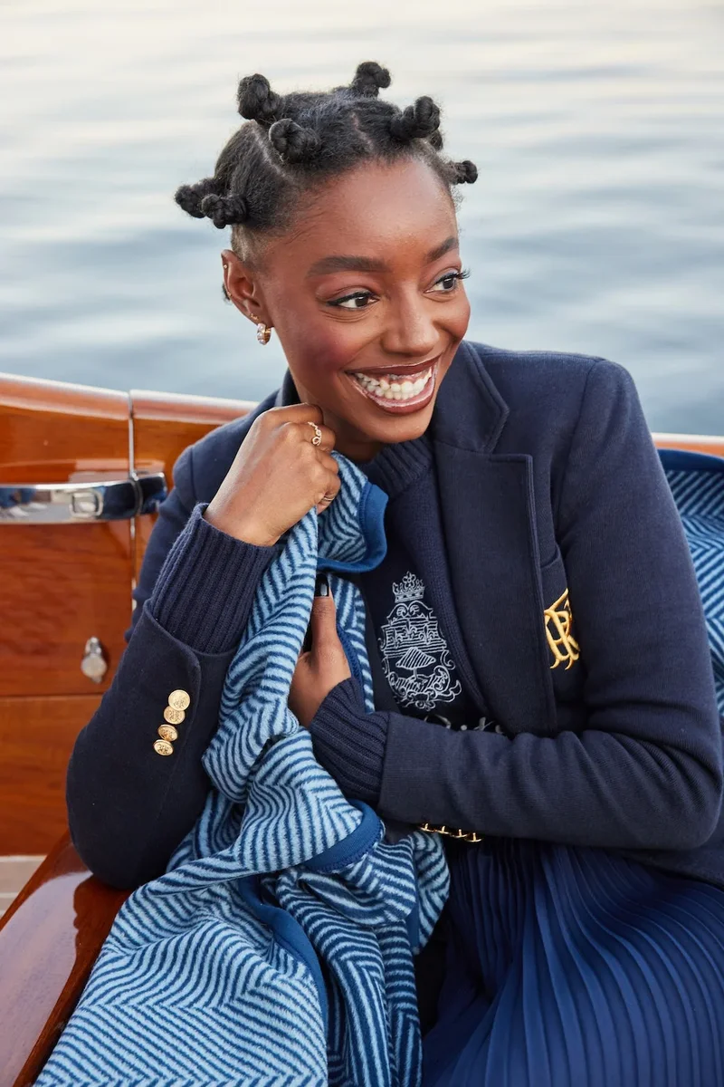 ChappyWrap Harborview Herringbone blanket draped over a person's lap aboard a boat