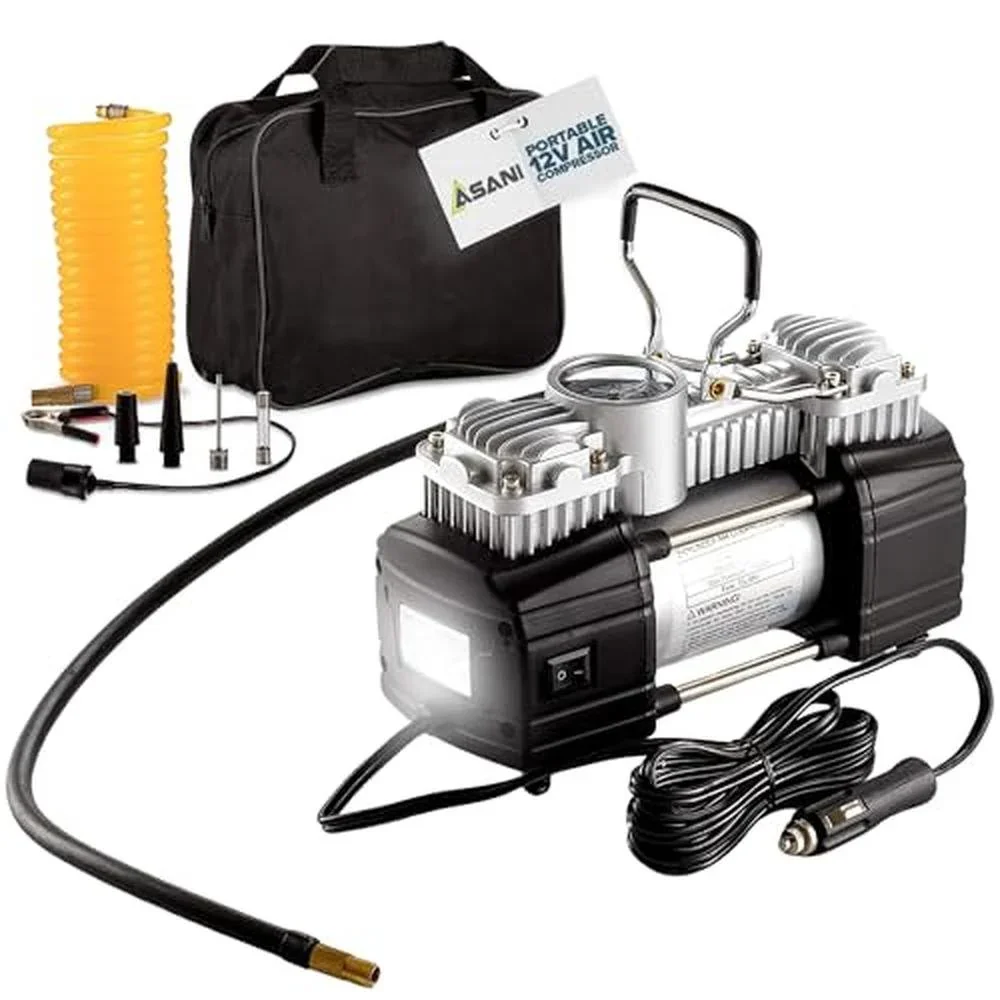 Asani 12V portable air compressor kit laid out with travel bag, yellow coiled hose, adapters, battery clamp cables, and cigarette lighter cord