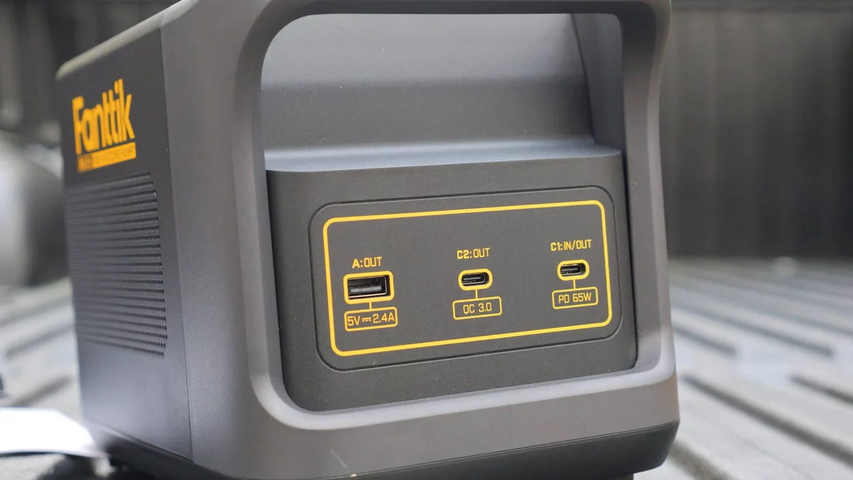 Fanttik X9 Ultra USB charging ports panel showing USB-A, USB-C QC 3.0, and USB-C PD 65W outputs