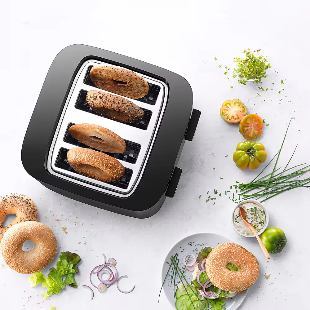 Zwilling Enfinigy toaster top-down lifestyle shot with bagels and artisan bread in wide slots