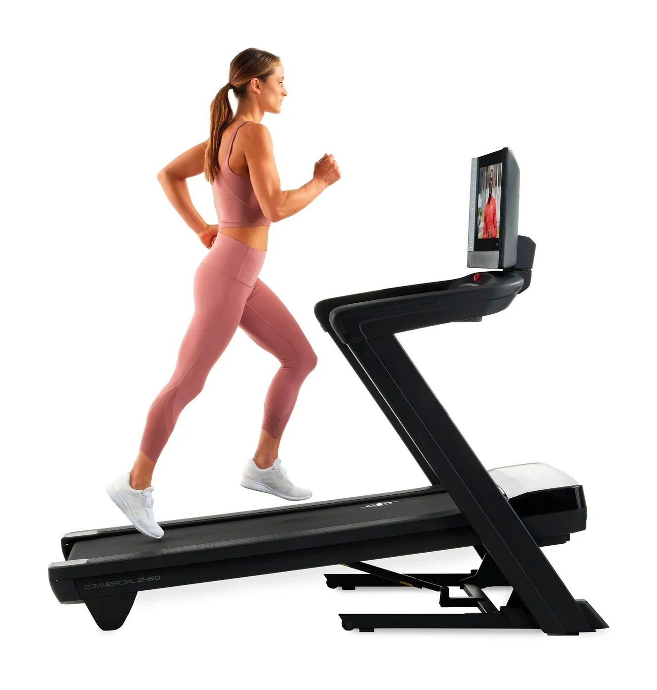 Woman running on NordicTrack Commercial 2450 treadmill lifestyle shot