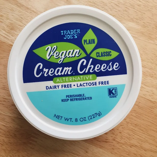 Trader Joe's Vegan Cream Cheese Alternative closed tub showing the packaging label from above on a wood surface