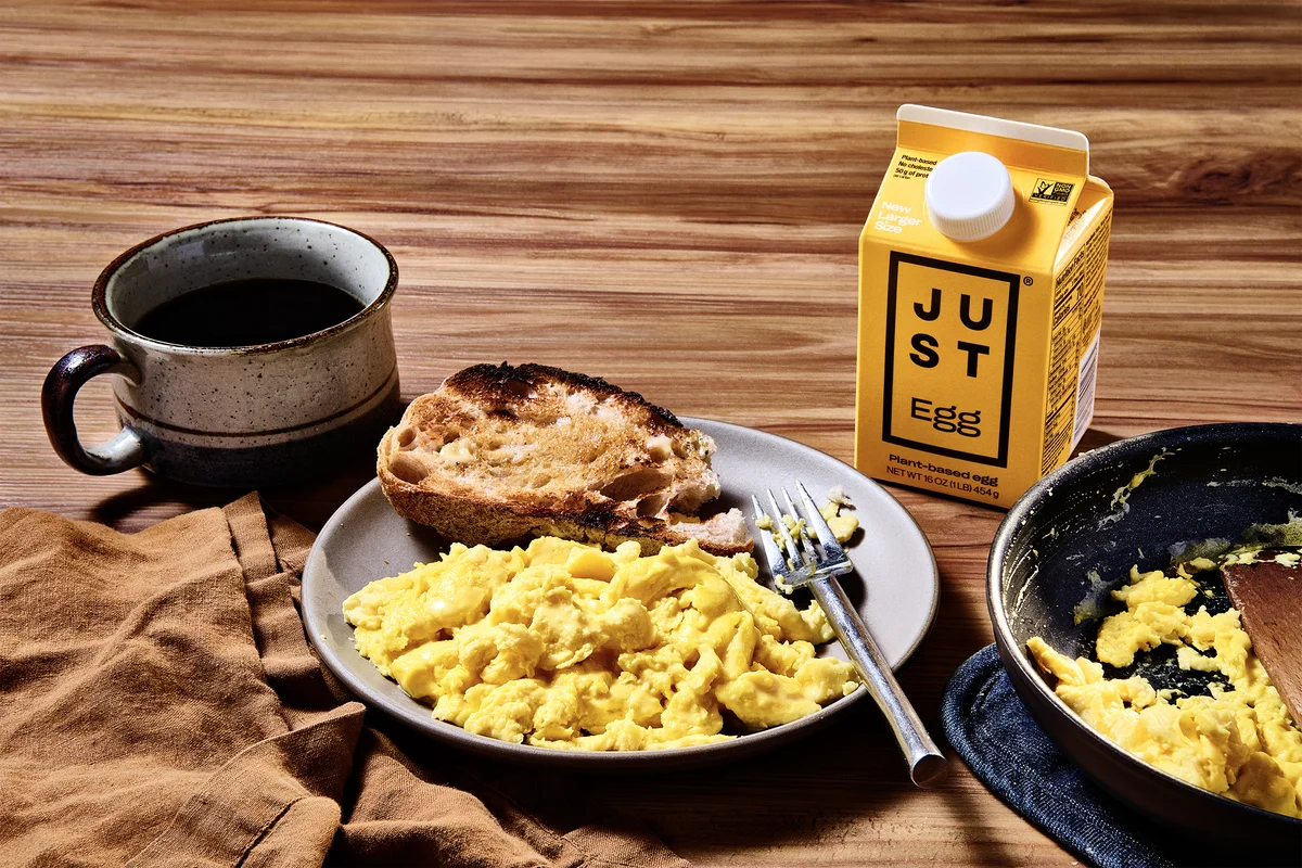 JUST Egg scramble breakfast plate with toast, blueberries, and carton