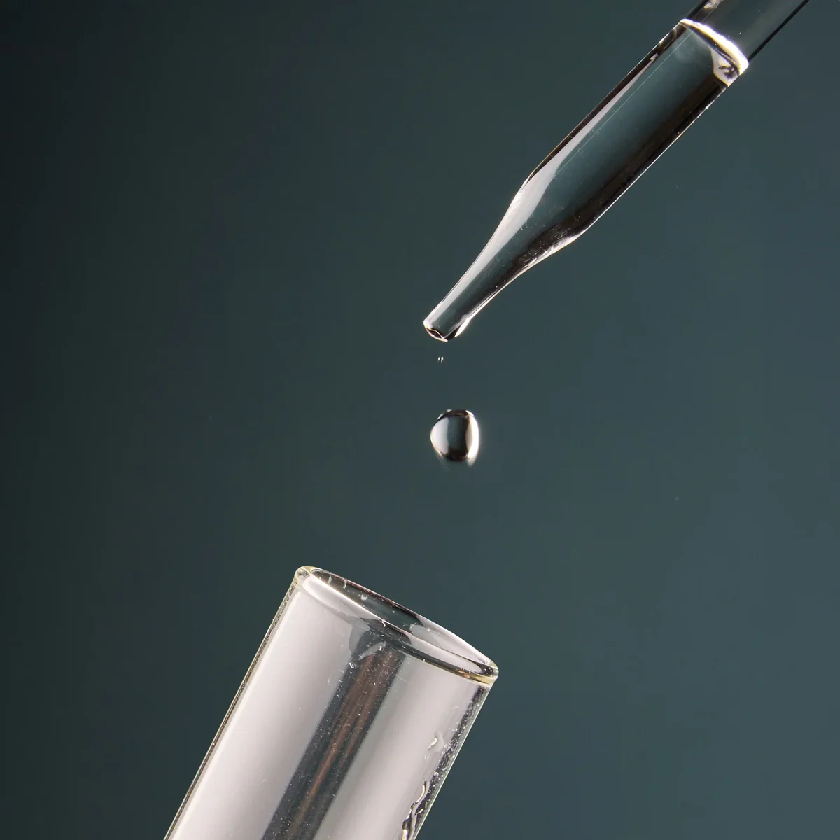 Lab pipette dropping water into a test tube, representing Clearly Filtered third-party testing