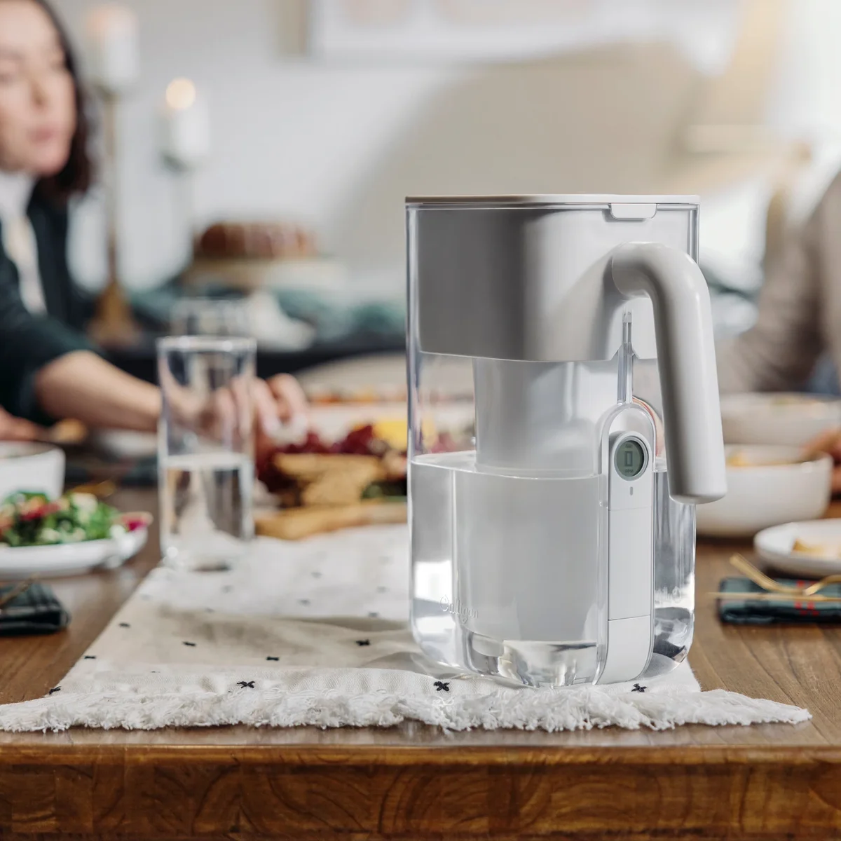 Culligan ZeroWater pitcher on dining table with family dinner in background