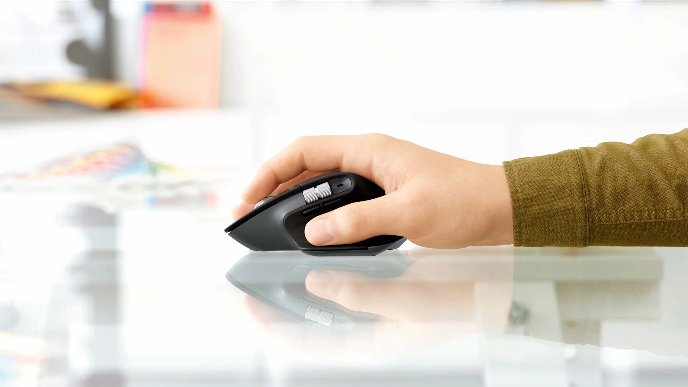 Logitech MX Master 3S in use on glass desk surface